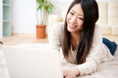 beautiful asian woman using a laptop computer
